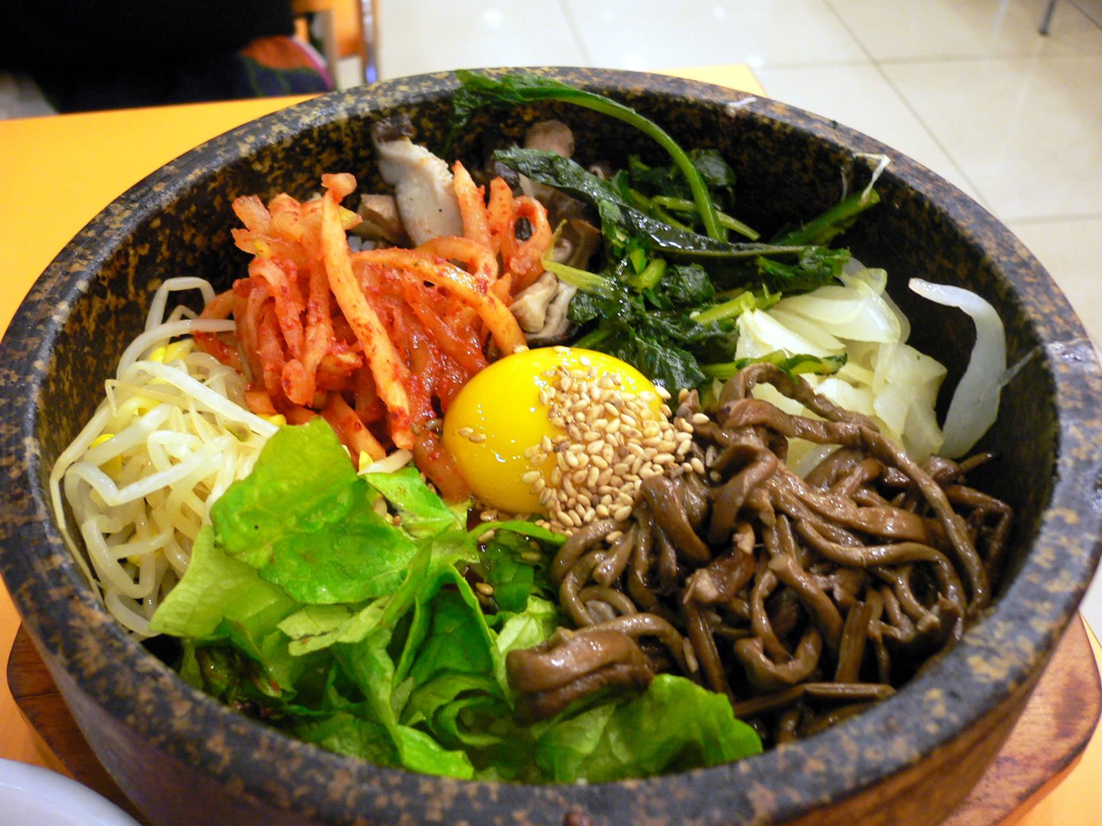 Bibimbap with vegetables, egg, rice, and gochujang